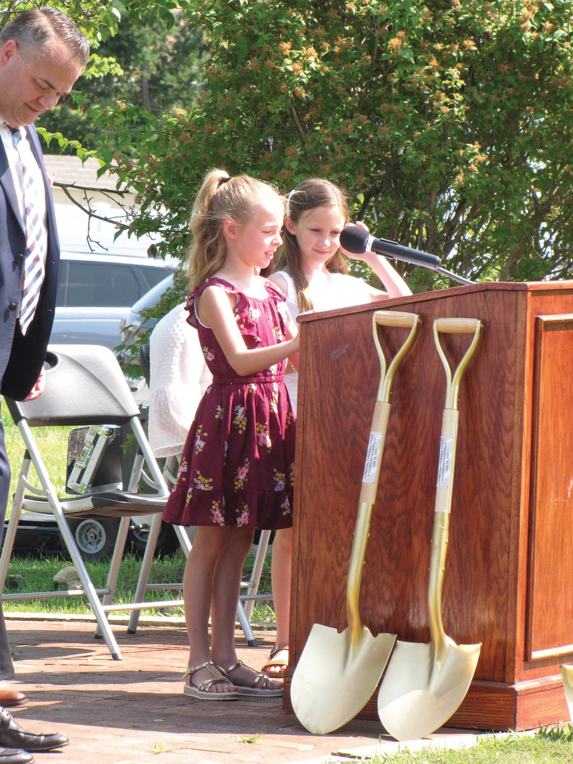 YOUNG VOICES: Jordan Robinson, left, and Charlotte Moffat, who will be third-graders this fall, spoke during last week’s groundbreaking ceremony at Garden City Elementary School.